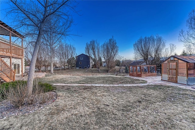 view of yard with an exterior structure and an outbuilding