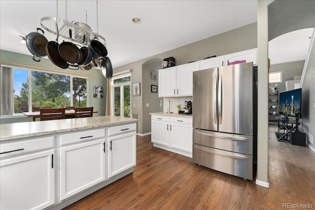 5370 S Gray St, Littleton, CO 80123 - kitchen with freestanding refrigerator, arched walkways, and dark wood finished floors