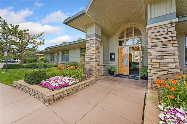 5370 S Gray St, Littleton, CO 80123 - doorway to property featuring stone siding