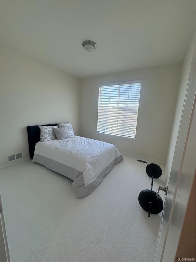 bedroom with carpet flooring and baseboards