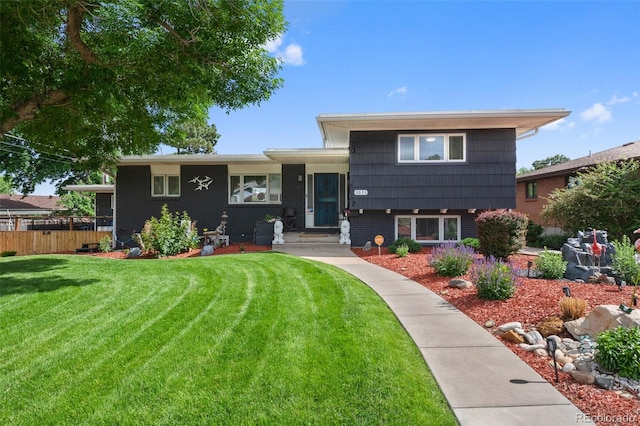 2633 Summit Dr, Colorado Springs, CO 80909 - split level home featuring brick siding