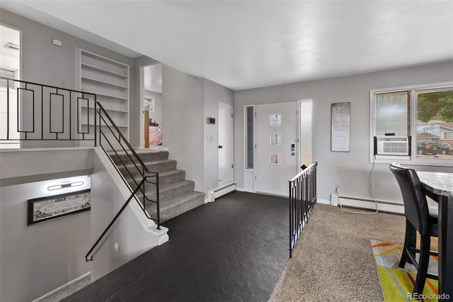 2633 Summit Dr, Colorado Springs, CO 80909 - carpeted foyer featuring baseboard heating and cooling unit