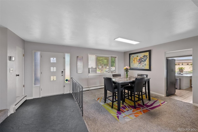 2633 Summit Dr, Colorado Springs, CO 80909 - carpeted dining space featuring baseboard heating and plenty of natural light
