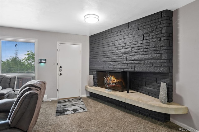 2633 Summit Dr, Colorado Springs, CO 80909 - living area featuring carpet floors and a fireplace