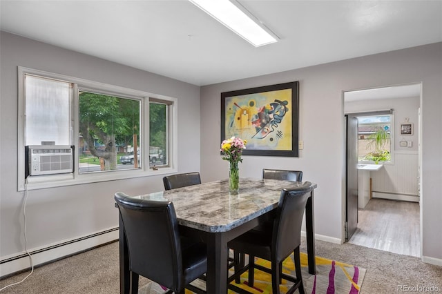2633 Summit Dr, Colorado Springs, CO 80909 - dining space featuring baseboard heating, light carpet, and cooling unit