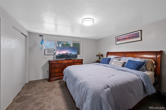 2633 Summit Dr, Colorado Springs, CO 80909 - bedroom with cooling unit, dark colored carpet, and a closet