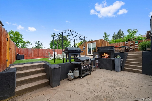 2633 Summit Dr, Colorado Springs, CO 80909 - fenced backyard with a patio, a grill, and a fire pit