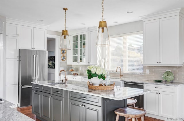 kitchen featuring stainless steel appliances and white cabinetry