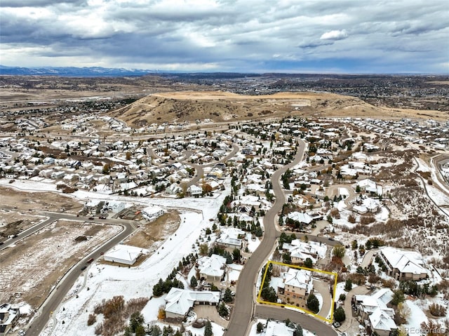 snowy aerial view featuring a mountain view