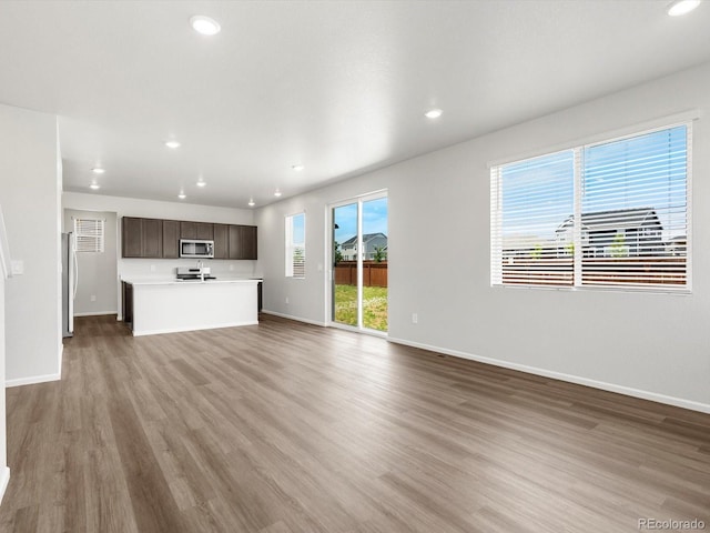 4635 Goldflower Dr, Johnstown, CO 80534 - unfurnished living room with light wood-style floors and recessed lighting
