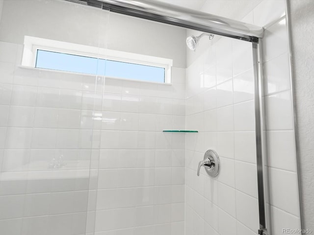 4635 Goldflower Dr, Johnstown, CO 80534 - full bathroom featuring tiled shower and plenty of natural light