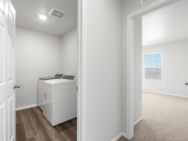 4635 Goldflower Dr, Johnstown, CO 80534 - laundry area with independent washer and dryer and wood finished floors