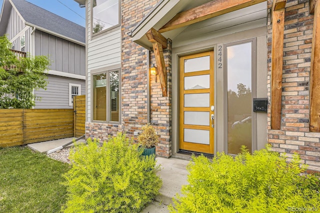 2442 S Bannock St, Denver, CO 80223 - property entrance with board and batten siding and brick siding