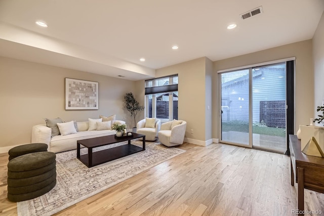 2442 S Bannock St, Denver, CO 80223 - living room featuring wood finished floors, baseboards, and recessed lighting
