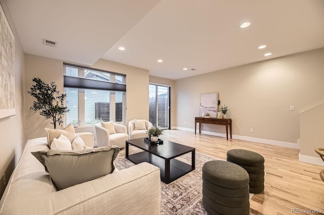 2442 S Bannock St, Denver, CO 80223 - living area featuring light wood-style floors, baseboards, and recessed lighting
