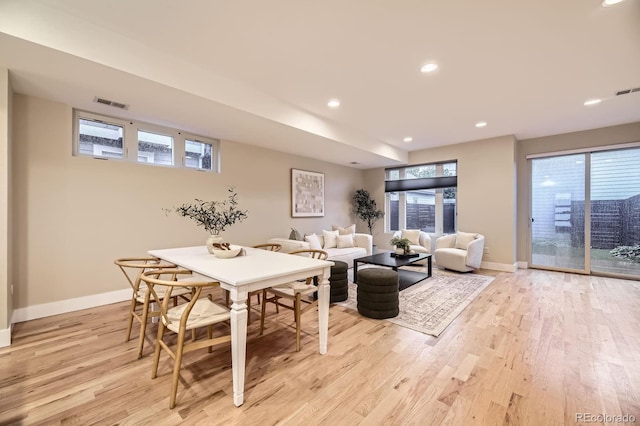 2442 S Bannock St, Denver, CO 80223 - dining room featuring light wood-style floors, baseboards, and recessed lighting