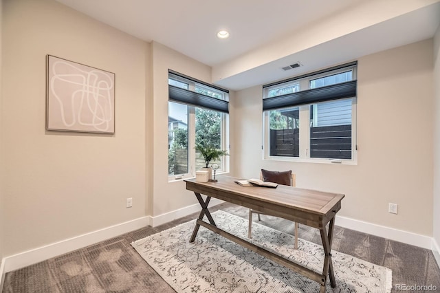 2442 S Bannock St, Denver, CO 80223 - home office featuring dark carpet, baseboards, and recessed lighting
