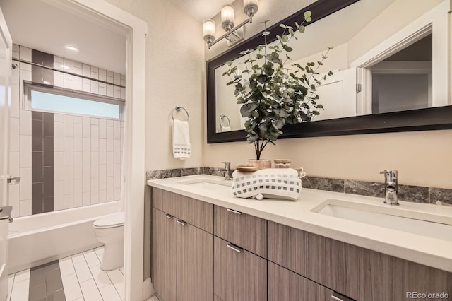 2442 S Bannock St, Denver, CO 80223 - full bath with toilet, double vanity, and shower / washtub combination