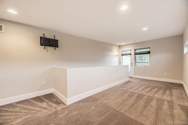 2442 S Bannock St, Denver, CO 80223 - carpeted spare room featuring baseboards and recessed lighting