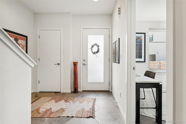 tiled foyer with plenty of natural light