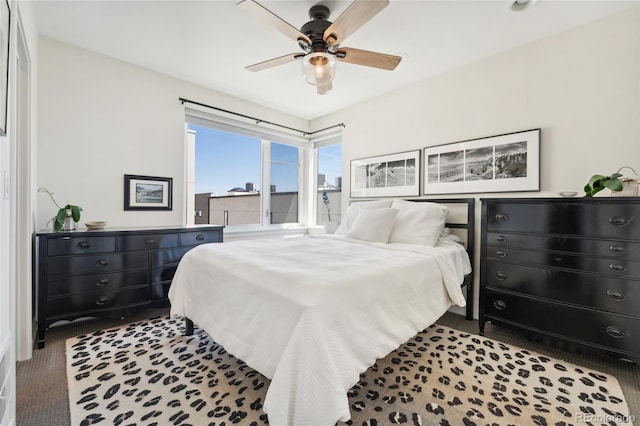 carpeted bedroom with a ceiling fan