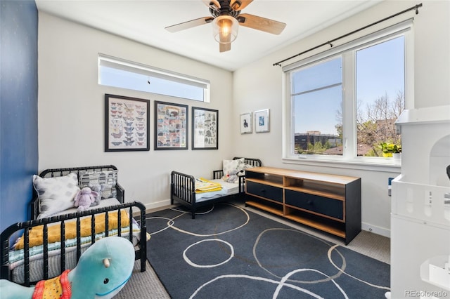 bedroom featuring carpet flooring and baseboards