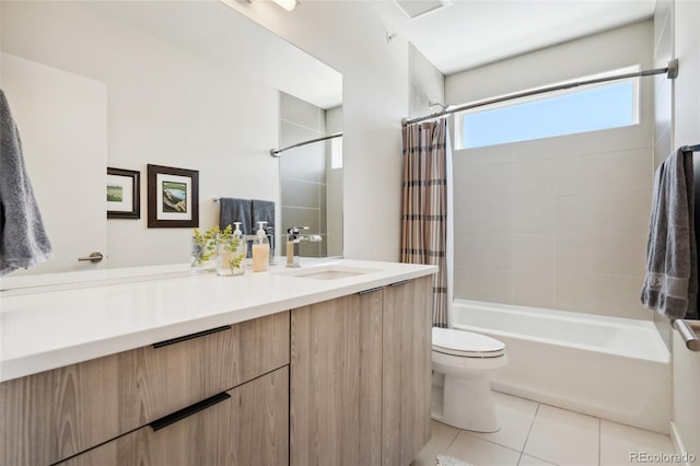 bathroom featuring toilet, tile patterned floors, shower / bath combo, and vanity