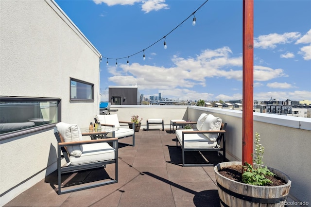 view of patio / terrace featuring a city view