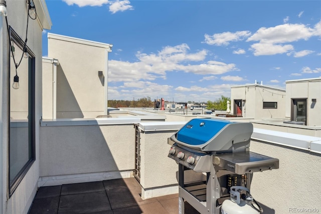 view of patio with a balcony and grilling area