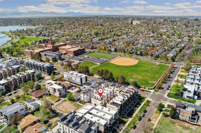 aerial view of property's location featuring a water and mountain view