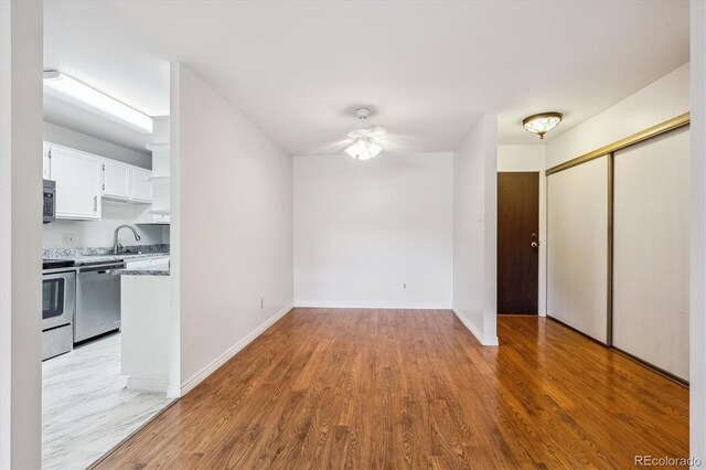 interior space featuring sink and light wood-type flooring