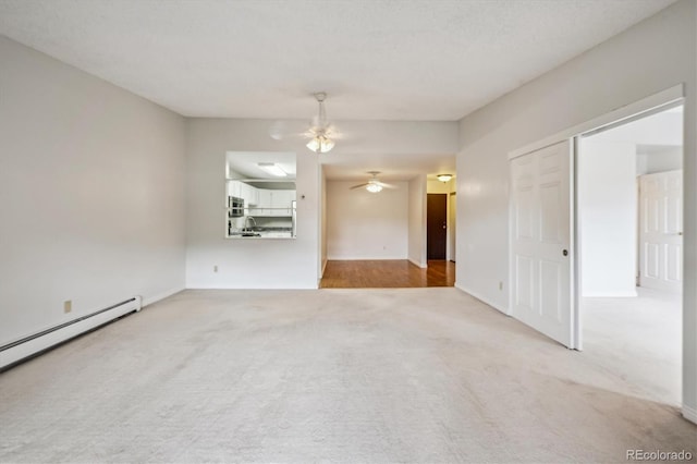 interior space with a baseboard radiator and ceiling fan