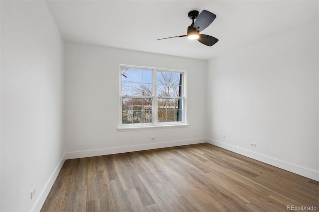 9120 E Girard Ave Unit 12, Denver, CO 80231 - spare room featuring wood finished floors and ceiling fan