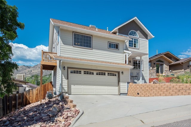 420 Sunshine Pkwy, Golden, CO 80403 - traditional-style home with an attached garage, fence, and concrete driveway