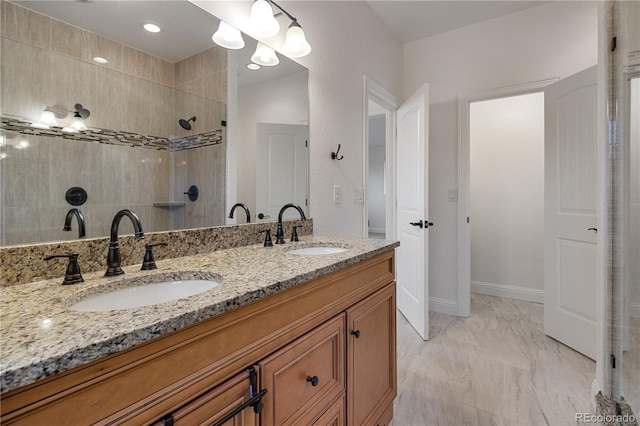420 Sunshine Pkwy, Golden, CO 80403 - full bath featuring a walk in shower, double vanity, marble look tile flooring, and baseboards