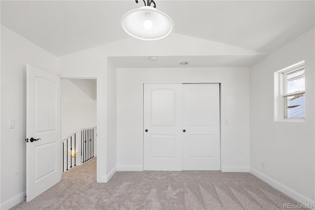 420 Sunshine Pkwy, Golden, CO 80403 - unfurnished bedroom with lofted ceiling, carpet flooring, a closet, and baseboards