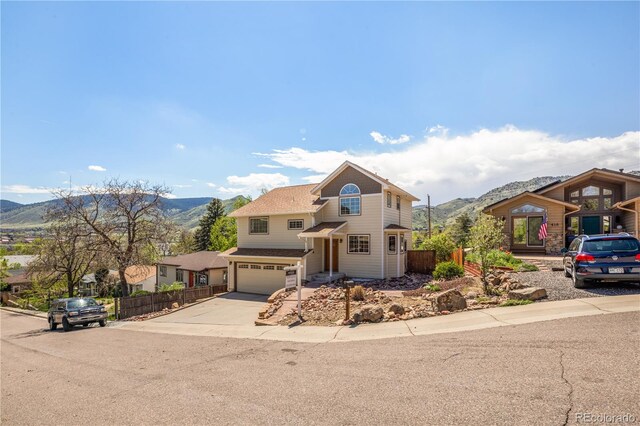 420 Sunshine Pkwy, Golden, CO 80403 - traditional home with a mountain view, fence, and driveway