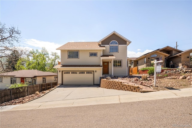 420 Sunshine Pkwy, Golden, CO 80403 - view of front of house featuring fence, a garage, driveway, and a shingled roof