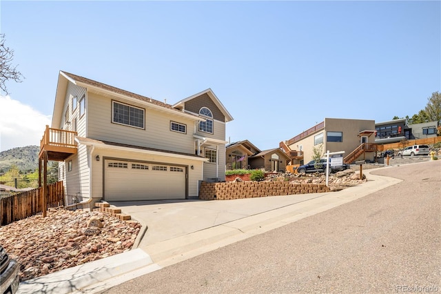 420 Sunshine Pkwy, Golden, CO 80403 - view of front facade featuring a garage, fence, and driveway