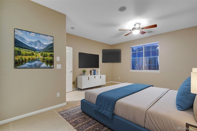 carpeted bedroom featuring ceiling fan