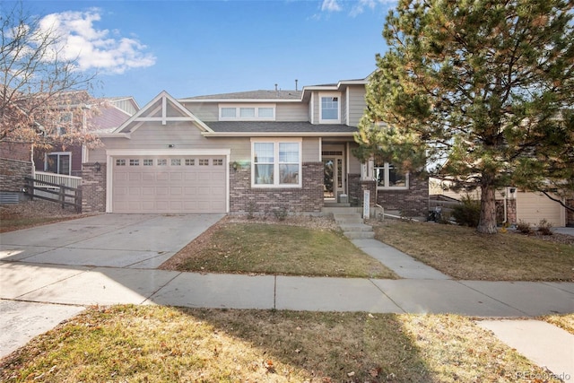 view of front of home with a front yard, concrete driveway, brick siding, and an attached garage