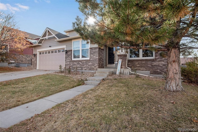 view of front of property with driveway, an attached garage, a front yard, and brick siding