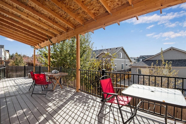 wooden terrace featuring outdoor dining area