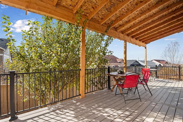 wooden terrace with outdoor dining space