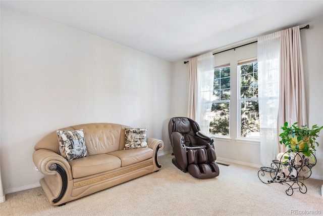 living area featuring carpet floors, plenty of natural light, and baseboards