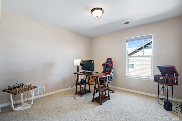 home office with carpet, visible vents, and baseboards