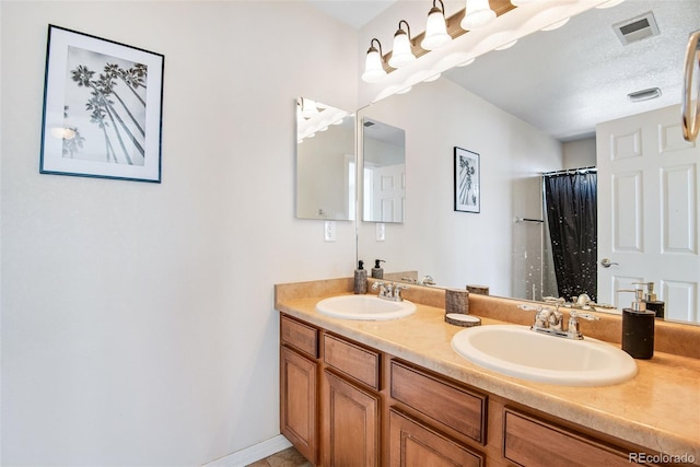 bathroom featuring double vanity, a sink, visible vents, and a shower with curtain