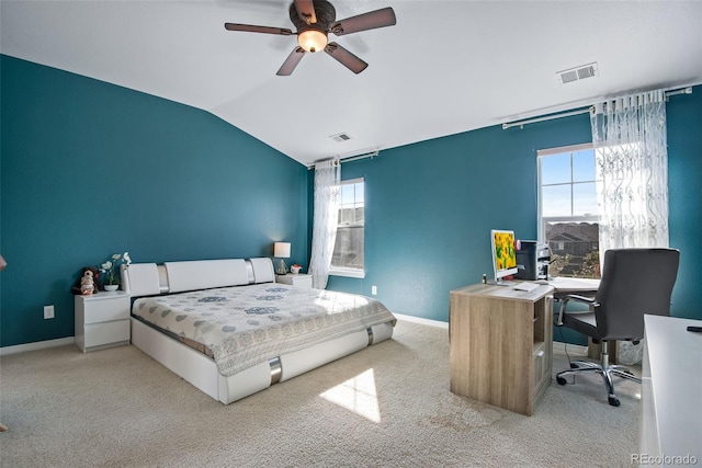 carpeted bedroom featuring vaulted ceiling, visible vents, and baseboards