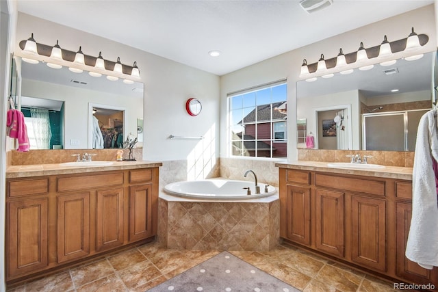 full bath featuring visible vents, a sink, a shower stall, and a bath