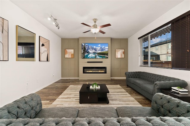 25127 E Maple Ave, Aurora, CO 80018 - living area featuring a ceiling fan, baseboards, wood finished floors, and a glass covered fireplace